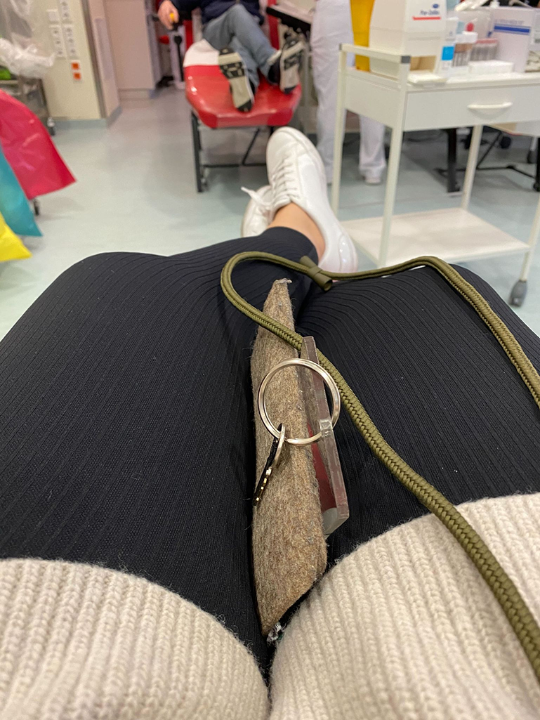 a person's leg with a keychain on it