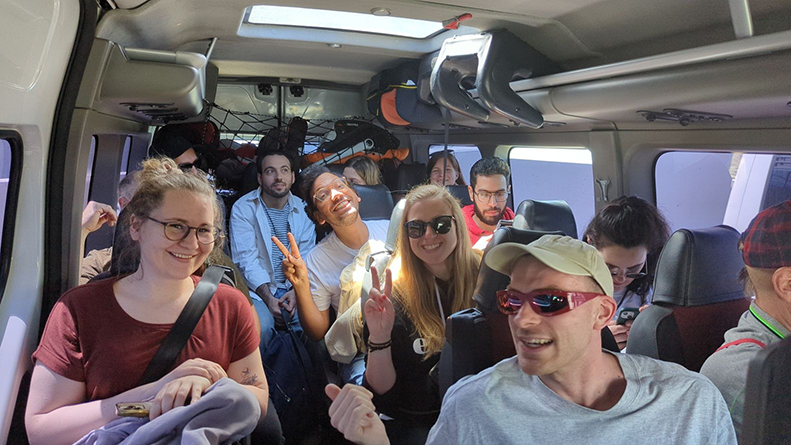 Jumping on the shuttle from the airport to the hotel. You can see Ziska and Amr in their first encounter with the team!